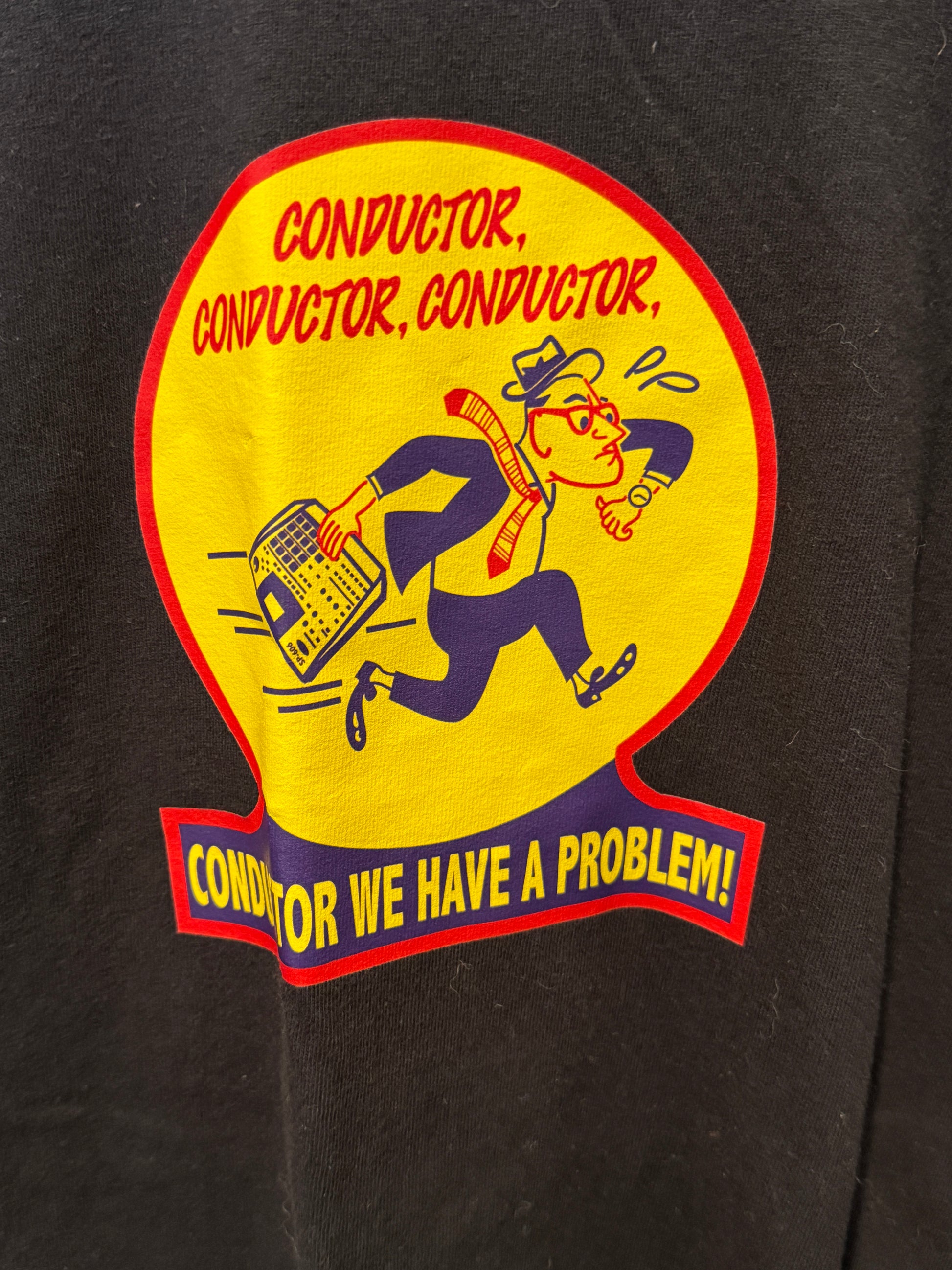 Sticker with a conductor graphic and text on a black background