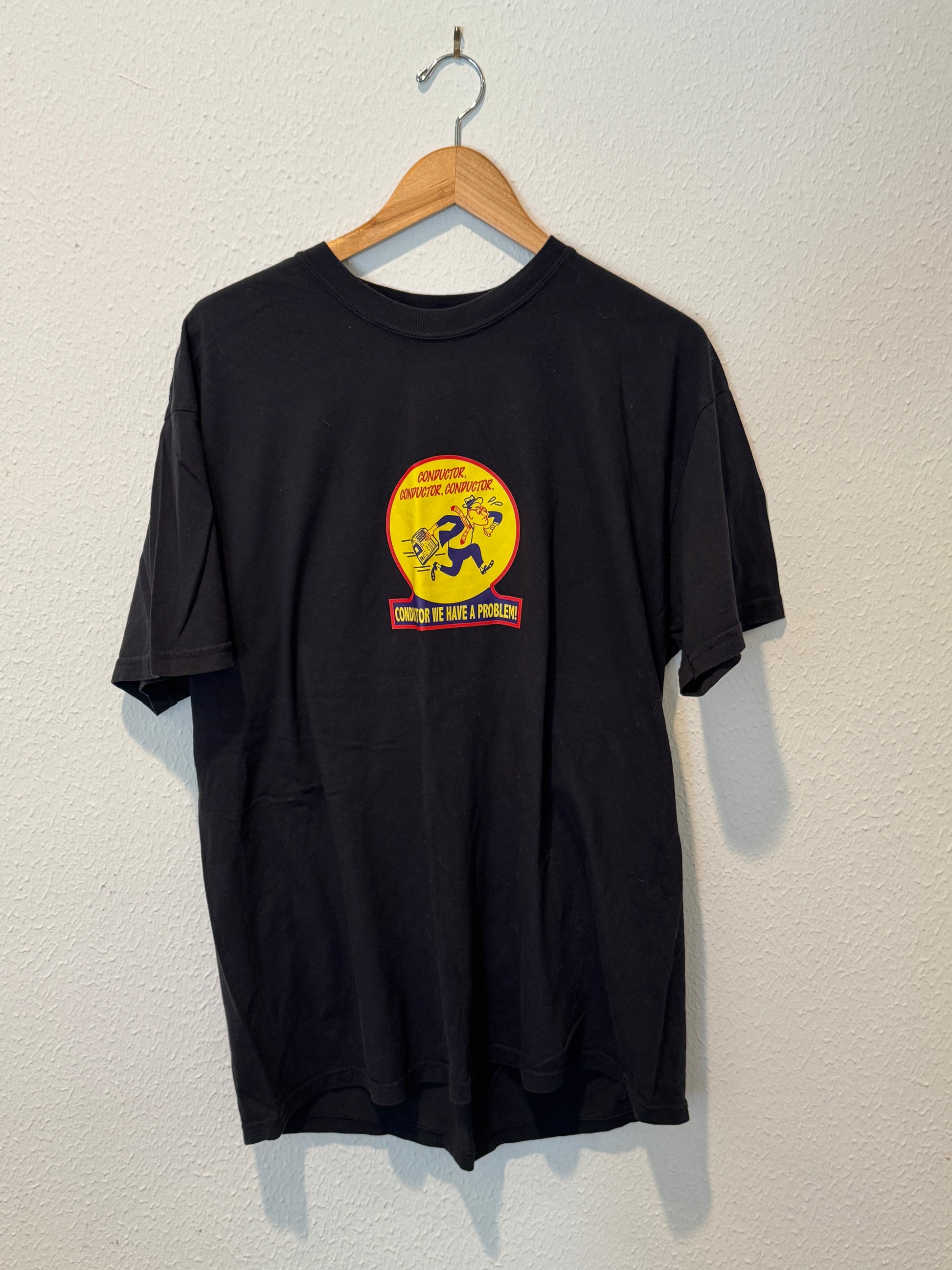 Black t-shirt with a colorful logo on a hanger against a light background