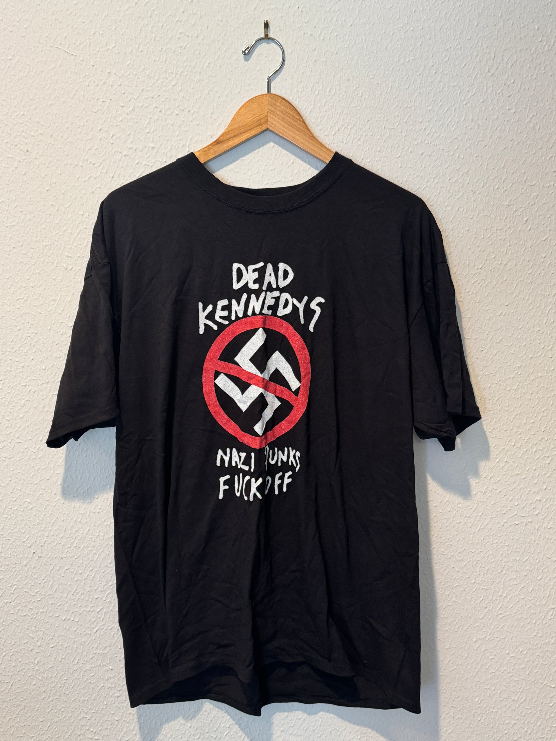 Black long-sleeve shirt with a controversial design on a white background
