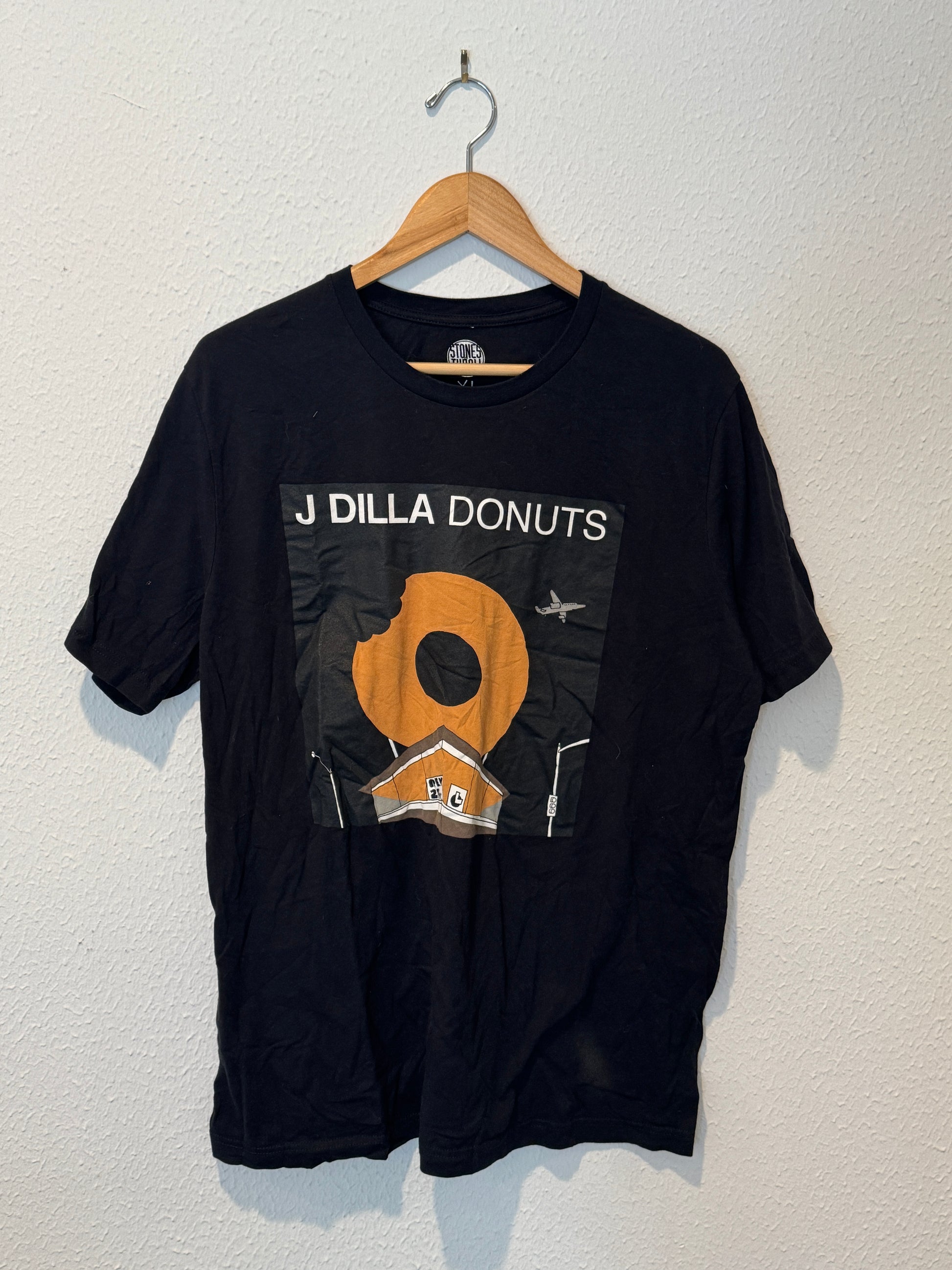 Black t-shirt with a graphic design on a white background