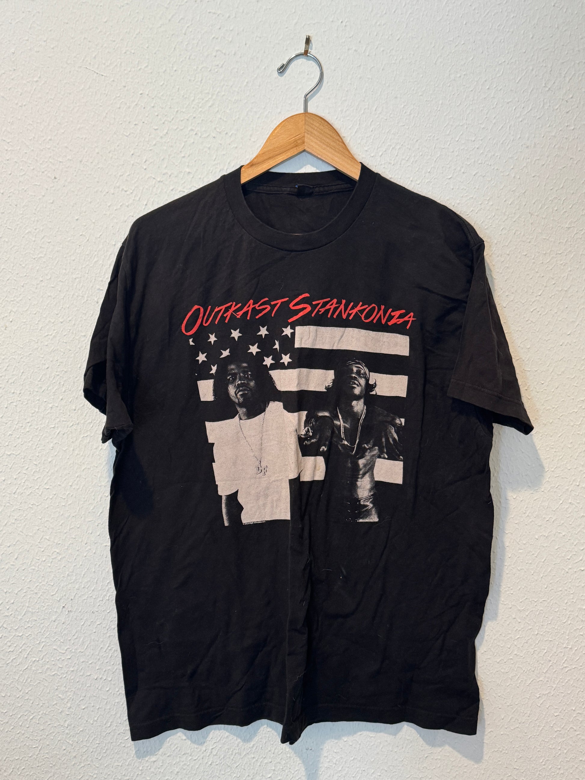 Black t-shirt with graphic design and text on a white background